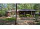 The home is surrounded by mature landscaping, ensuring privacy and a connection with nature at 5315 Mccormick Rd, Durham, NC 27713
