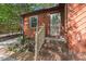 Charming front entrance with brick steps, a decorative glass door, and lovely garden details at 5315 Mccormick Rd, Durham, NC 27713