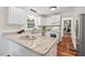Updated kitchen featuring stainless steel appliances, granite countertops, and white cabinets at 5315 Mccormick Rd, Durham, NC 27713
