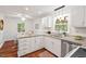 Kitchen with an eat-in dining area, featuring granite countertops and stainless steel dishwasher at 5315 Mccormick Rd, Durham, NC 27713