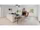 Bright living room boasts a brick fireplace, recessed lighting, and a ceiling fan at 5315 Mccormick Rd, Durham, NC 27713