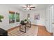 The room has a modern desk, hardwood floors, white trim, and a screened porch off to the side at 5315 Mccormick Rd, Durham, NC 27713