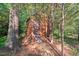 Outdoor storage shed surrounded by lush greenery providing extra space at 5315 Mccormick Rd, Durham, NC 27713