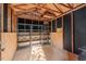 Interior of shed featuring wooden floors, ceiling beams, and metal storage shelves for organization at 5315 Mccormick Rd, Durham, NC 27713