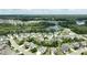 Aerial view of a residential neighborhood with mature trees, and a beautiful lake at 553 Lake Gaston Dr, Fuquay Varina, NC 27526