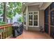 Back deck showcases a grill and view to the backyard, offering a space for outdoor cooking and enjoyment at 553 Lake Gaston Dr, Fuquay Varina, NC 27526