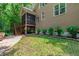 The home features a beautifully landscaped yard with a screened porch and wooden stairs at 553 Lake Gaston Dr, Fuquay Varina, NC 27526