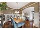 Dining room features hardwood floors, modern lighting, and an open layout at 553 Lake Gaston Dr, Fuquay Varina, NC 27526