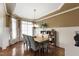 Dining room featuring hardwood floors, modern lighting, and wainscoting at 553 Lake Gaston Dr, Fuquay Varina, NC 27526