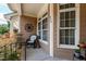 Charming front porch with rocking chair and decorative house numbers, creating a welcoming entry at 553 Lake Gaston Dr, Fuquay Varina, NC 27526
