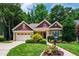 Charming home featuring well-manicured lawn and meticulously landscaped front yard at 553 Lake Gaston Dr, Fuquay Varina, NC 27526