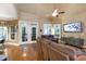 Relaxing living room featuring vaulted ceilings, hardwood floors, and a TV at 553 Lake Gaston Dr, Fuquay Varina, NC 27526