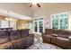 Comfortable living room boasts vaulted ceilings, natural light, and cozy seating at 553 Lake Gaston Dr, Fuquay Varina, NC 27526