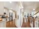 Open-concept living space showcasing hardwood floors, kitchen, and staircase at 553 Lake Gaston Dr, Fuquay Varina, NC 27526