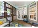 Cozy screened porch with wicker seating and view to the back of the home, creating a relaxing outdoor space at 553 Lake Gaston Dr, Fuquay Varina, NC 27526