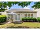 Well-maintained backyard featuring patio, table, umbrella, and a neatly trimmed hedge at 575 Tomkins Loop, Cary, NC 27519
