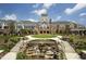 Luxurious clubhouse with stunning architecture, a water feature, and landscaped grounds at 575 Tomkins Loop, Cary, NC 27519