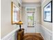 Inviting entryway with decorative table, elegant lighting, and beautiful framed artwork at 575 Tomkins Loop, Cary, NC 27519