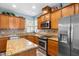 Well-equipped kitchen featuring stainless steel appliances, granite countertops, and ample storage at 575 Tomkins Loop, Cary, NC 27519