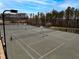 Multiple tennis courts surrounded by mature trees on a bright day in this wonderful community at 575 Tomkins Loop, Cary, NC 27519