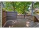 Spacious back deck with a privacy fence and lush green surroundings at 5905 Westcreek Pl, Raleigh, NC 27606