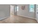 Bright bedroom with hardwood floors and windows allowing natural light at 5905 Westcreek Pl, Raleigh, NC 27606
