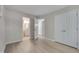 Spacious bedroom with hardwood floors and access to an ensuite bathroom at 5905 Westcreek Pl, Raleigh, NC 27606
