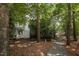 The backyard has privacy fence and mature landscaping at 6 Parsons Chase Ln, Durham, NC 27713