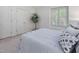 Comfortable bedroom features neutral carpeting, closet, and a window for ample natural light at 6 Parsons Chase Ln, Durham, NC 27713