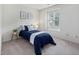Bright bedroom with a window, neutral walls, and carpet at 6 Parsons Chase Ln, Durham, NC 27713