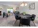 Open-concept dining area next to the living room filled with natural light and stylish furnishings at 6 Parsons Chase Ln, Durham, NC 27713