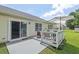 Backyard featuring a patio with an umbrella and sliding glass doors at 611 Quartz Dr, Durham, NC 27703