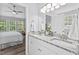 Well-lit bathroom with double sink vanity and natural lighting at 611 Quartz Dr, Durham, NC 27703