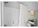 Shower-tub combination in bathroom featuring a shower curtain and wall-mounted products at 611 Quartz Dr, Durham, NC 27703