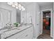 Bathroom with double sink vanity, granite countertop, and walk-in closet at 611 Quartz Dr, Durham, NC 27703