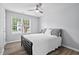 Bright bedroom featuring a ceiling fan, natural light, and stylish decor at 611 Quartz Dr, Durham, NC 27703