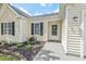 Cozy home featuring a welcoming front porch and meticulous landscaping at 611 Quartz Dr, Durham, NC 27703