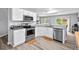 Modern kitchen featuring stainless steel appliances, sleek countertops, and ample cabinet space at 611 Quartz Dr, Durham, NC 27703