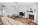 Inviting living room with fireplace, modern furniture, and ample natural light at 611 Quartz Dr, Durham, NC 27703
