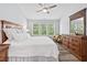 Spacious bedroom features three windows offering an abundance of natural light at 611 Quartz Dr, Durham, NC 27703