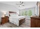 Bright bedroom with vaulted ceiling, ceiling fan, and hardwood floors at 611 Quartz Dr, Durham, NC 27703