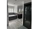 The bathroom features tiled floors, a garden tub, a shower, and a vanity with a mirror at 6225 Acorn Ridge Trl, Hillsborough, NC 27278