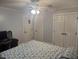 Bedroom with blue and white bedding, a ceiling fan, LED lights, and double-door closets at 6225 Acorn Ridge Trl, Hillsborough, NC 27278