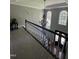 Bright foyer with a view of the front door, dark wood floors, chandelier, and arched windows at 6225 Acorn Ridge Trl, Hillsborough, NC 27278