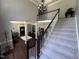 Spacious foyer with a staircase, providing an open view to the living areas, and hardwood floors at 6225 Acorn Ridge Trl, Hillsborough, NC 27278