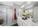 Modern bathroom with a glass enclosed shower, double sink vanity, and contemporary fixtures at 6300 Pleasant Pines Dr # 101, Raleigh, NC 27613