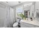 Cozy bathroom with a shower and tub combination, featuring a white vanity and gray walls at 6300 Pleasant Pines Dr # 101, Raleigh, NC 27613