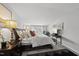 Comfortable bedroom with an accent table and lamp, large bed, and natural light at 6300 Pleasant Pines Dr # 101, Raleigh, NC 27613