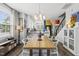 The dining area boasts an inviting wood table and modern lighting fixtures at 6300 Pleasant Pines Dr # 101, Raleigh, NC 27613
