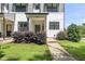 Close up of a townhouse exterior with a well-kept lawn and attractive landscaping at 6300 Pleasant Pines Dr # 101, Raleigh, NC 27613